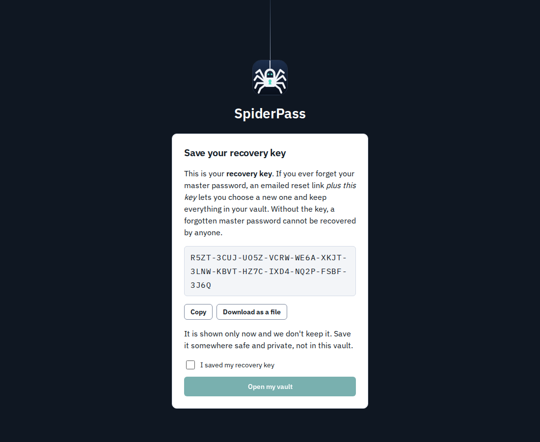 The recovery key screen shown after sign-up: a 52-letter key in groups of four, with Copy and Download buttons and a box to confirm it was saved.